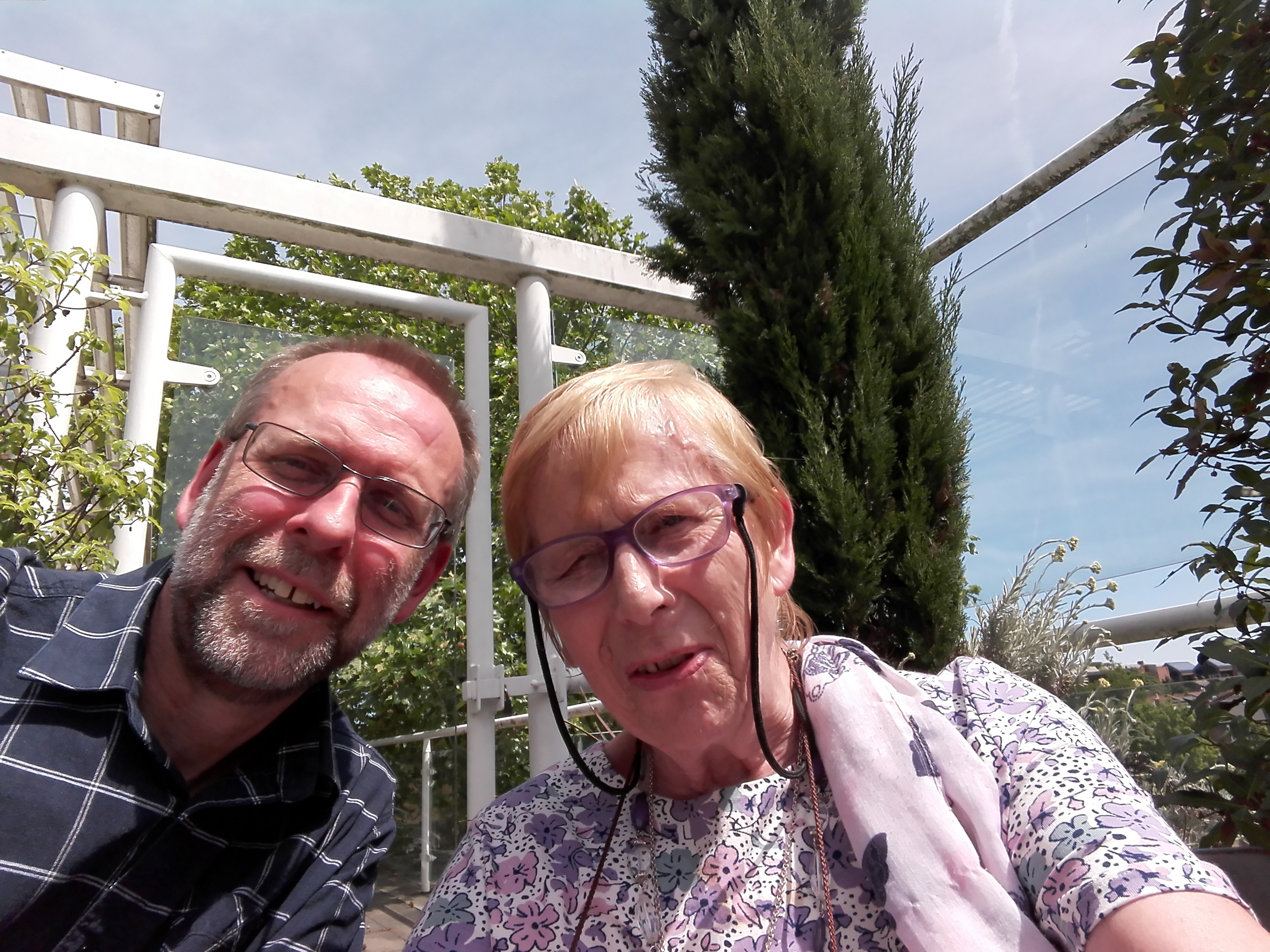 I spent a lovely time with Mum visiting Claire yesterday.  Here's a photo of us waiting for Claire to join us on the balcony.  We had taken notice of Naomi’s instructions, so Mum decided to brush Claire’s hair.  Despite spending hours “doing” Claire’s hair when she was a little girl, Mum had lost the knack when it came to putting her hair back into a ponytail but a nurse came to the rescue.  Mum then decided to try putting some face cream on Claire, but the vast array of lotions and potions caused a challenge as we couldn’t work out what they were all for, however once again the nurse came to the rescue.
You can see just how wonderful the staff at St. George’s are and I would like to say a huge thank you to them all for the wonderful care that they have provided to Claire.  I will be quite sad not to visit St. George’s next time I visit Claire, but I trust that Claire’s move to Putney will mark the start of a new and positive chapter.  By way of an indication, I was convinced that I sensed a spark of my little sister returning when I came to depart and say goodbye.  Don’t ask me how I knew ... just call it a big brother’s intuition!

